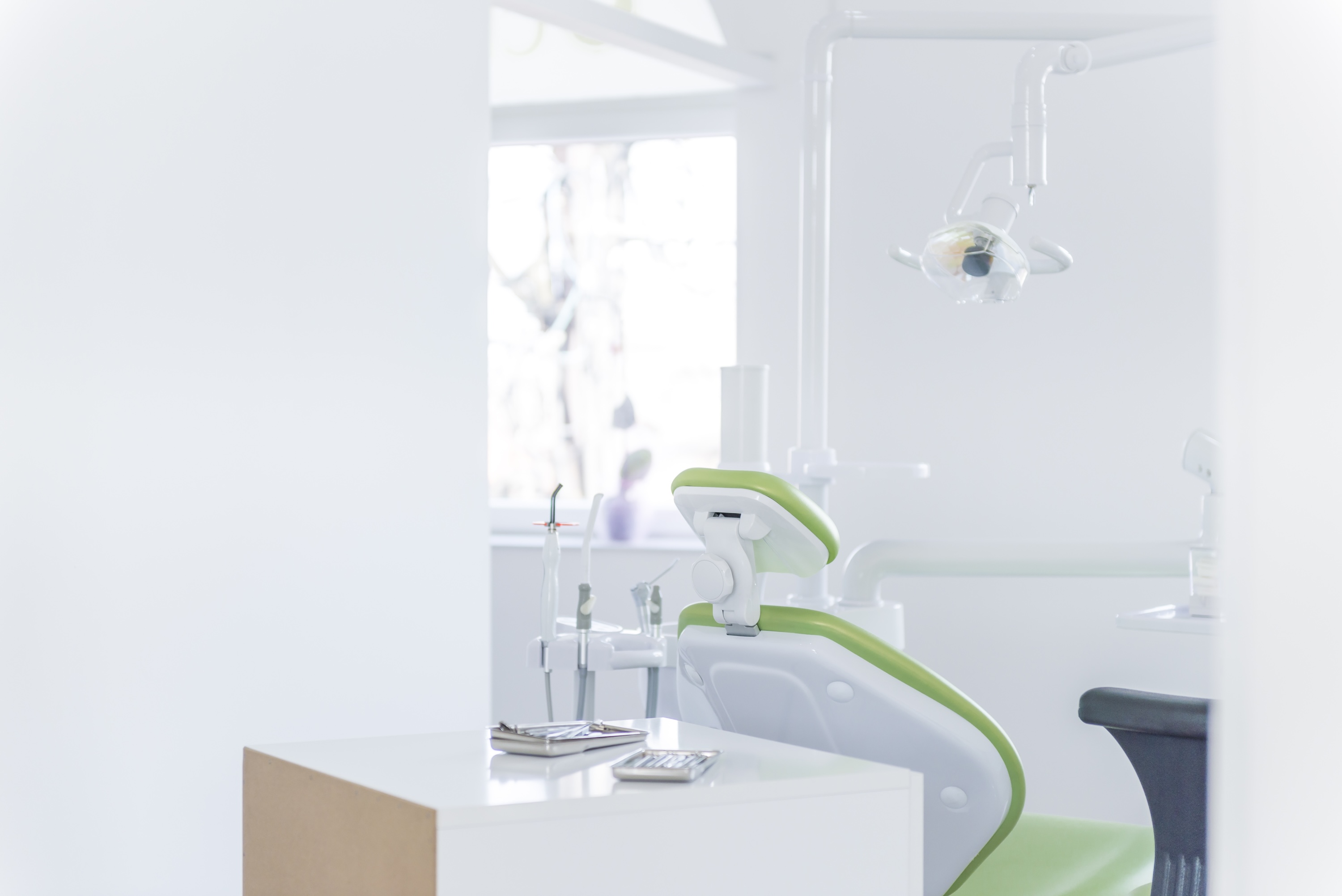 modern dental treatment room with blank walls misses out on opportunity to leverage strategic print marketing for dentists