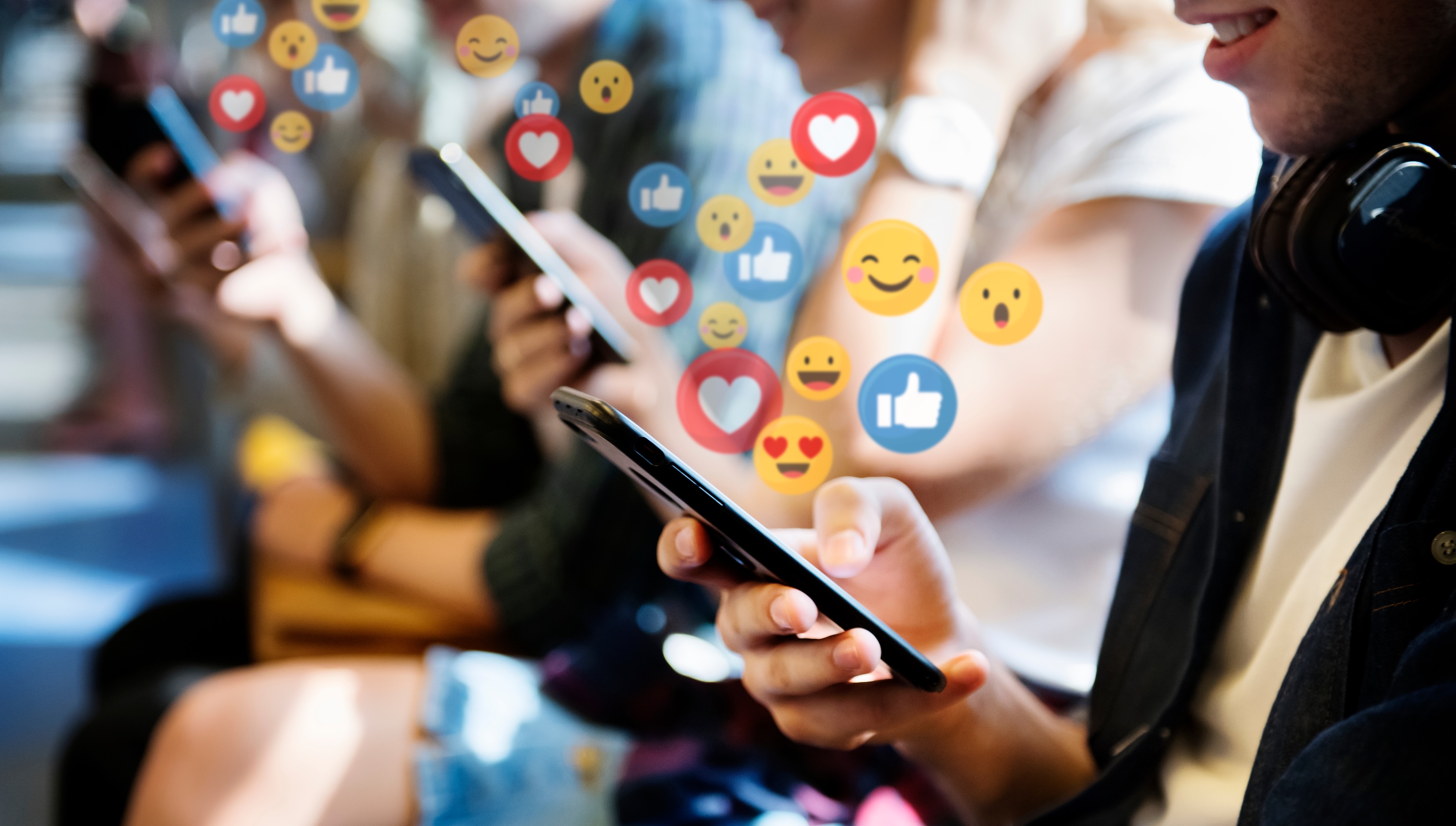 crowd of people on smart phones using social media concept shows importance of social media management for dentists